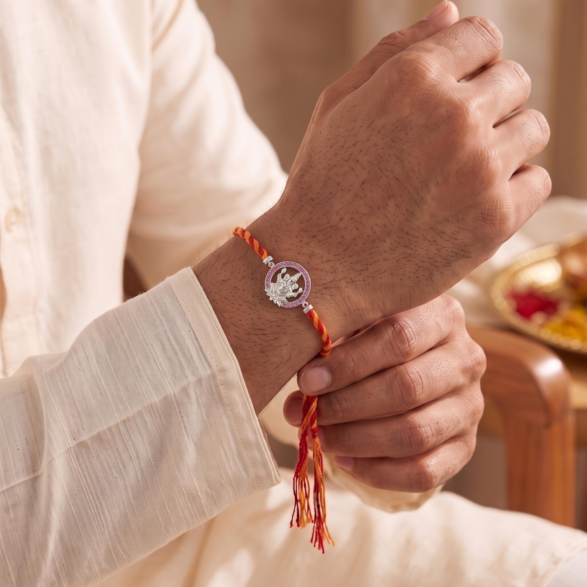 Divine Ganesha Ruby CZ Silver Rakhi ,